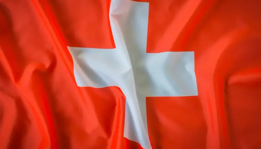 Flaga Szwajcarii. Chcesz wiedzieć, jak zaadresować list do Szwajcarii?